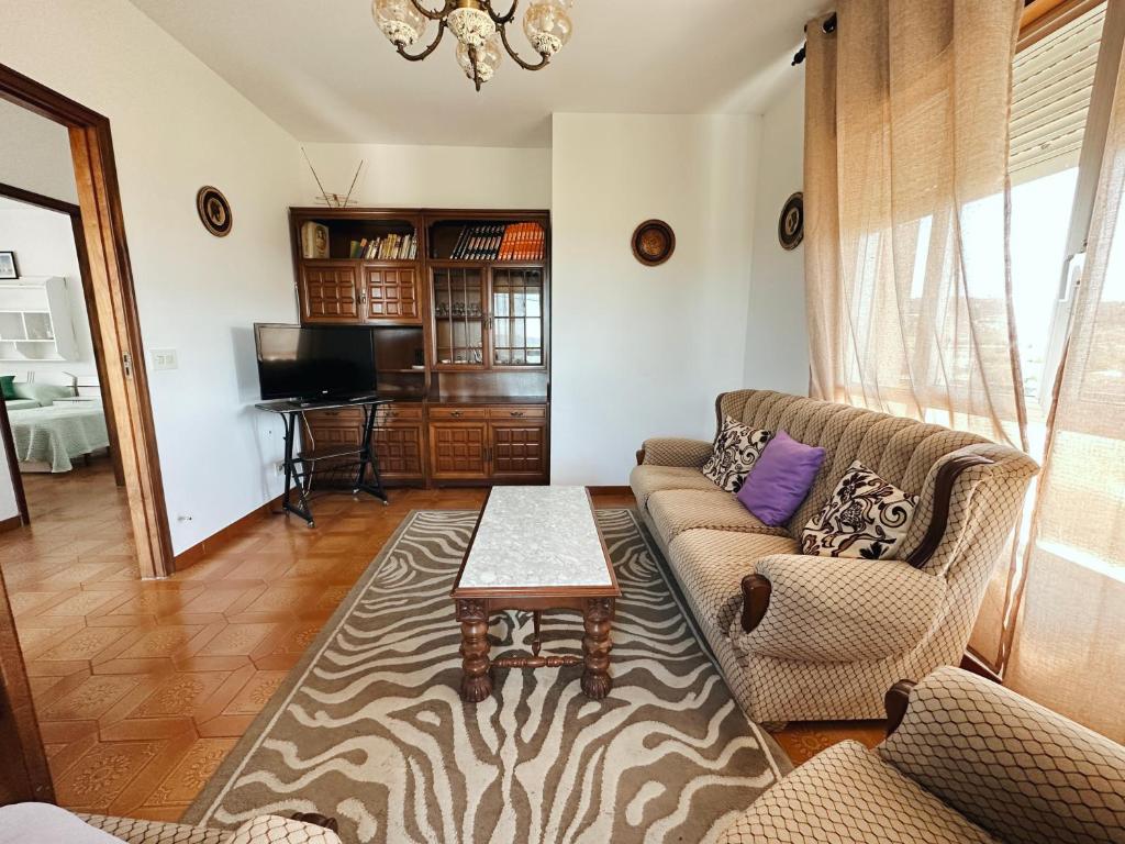 a living room with a couch and a table at Casa Sear-Bordóns in Sear