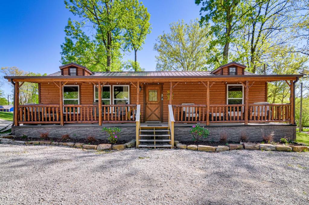 a large log cabin with a porch and a deck at Somerset Cabin, Close to Lake Access! in Somerset