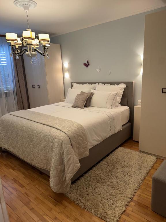 Postel nebo postele na pokoji v ubytování Apartments Ragusa