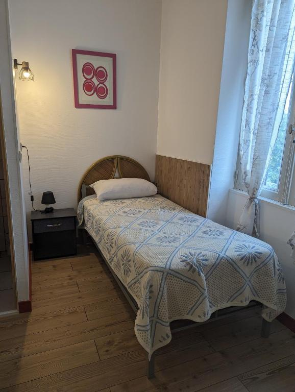 Postel nebo postele na pokoji v ubytování Auberge Des Pins