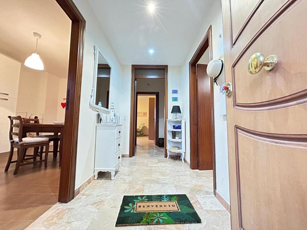 a hallway with a door and a dining room at Casa Vacanze Nonno Giò in Sulmona