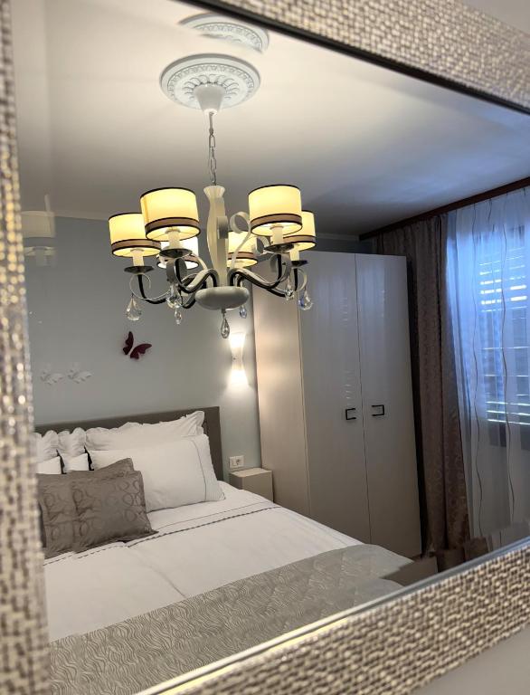 Postel nebo postele na pokoji v ubytování Apartments Ragusa