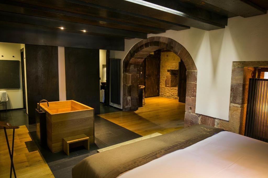 Postel nebo postele na pokoji v ubytování Hotel Boutique El Convento de Mave