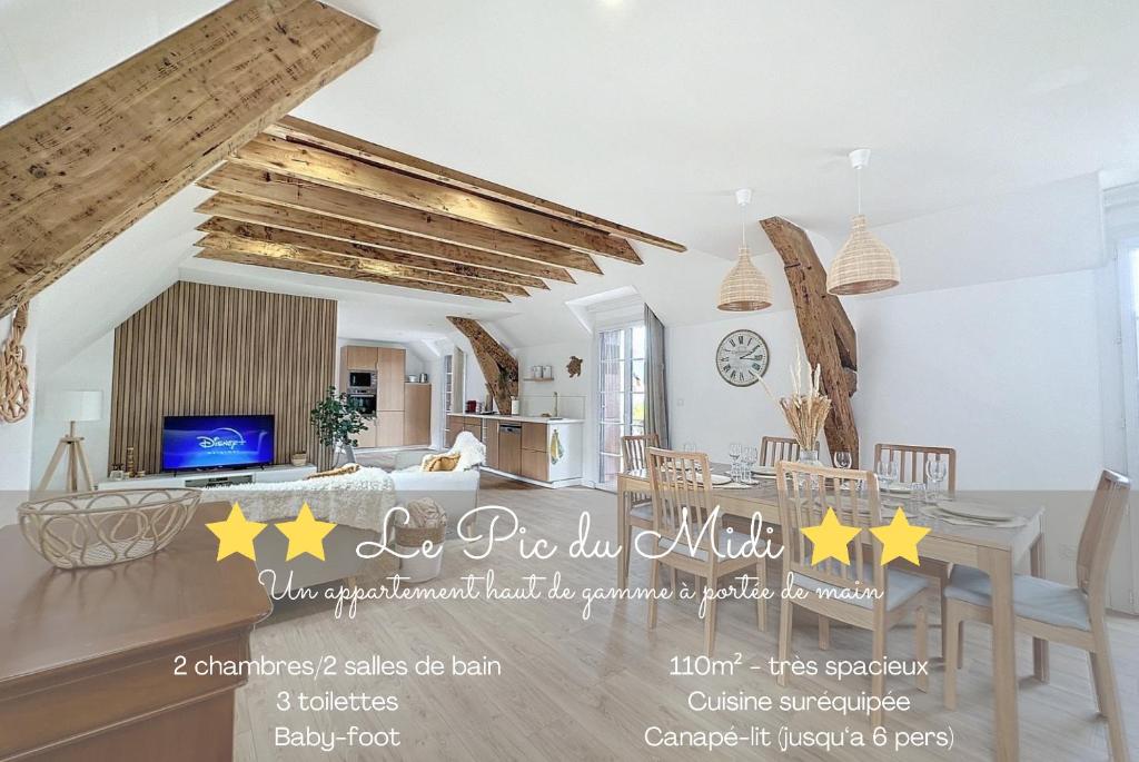 a kitchen and living room with a table and chairs at [PARENTHESE] Le Pic du Midi - 110m² in Bagnères-de-Bigorre