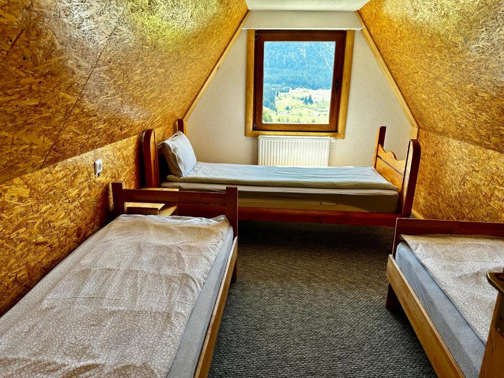 Postel nebo postele na pokoji v ubytování Vlasic Odmor - Villa Kraljica
