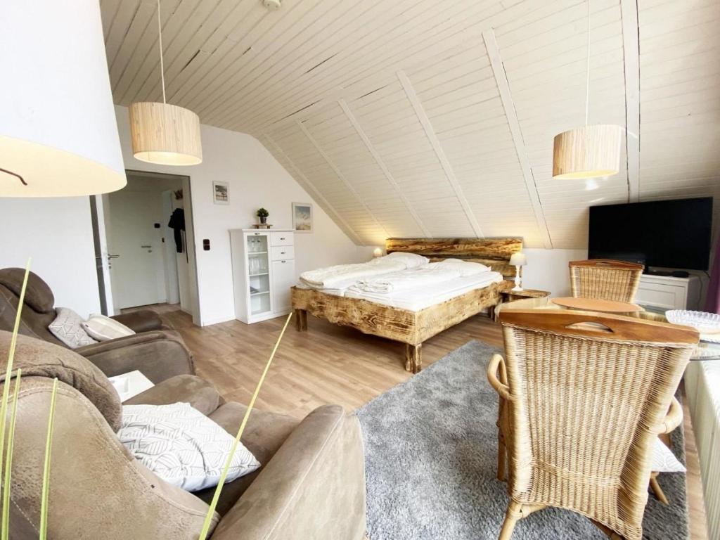 Ένα ή περισσότερα κρεβάτια σε δωμάτιο στο Ferien im Wangerland - Haus Wiesenweg - Apartment 3 1OG