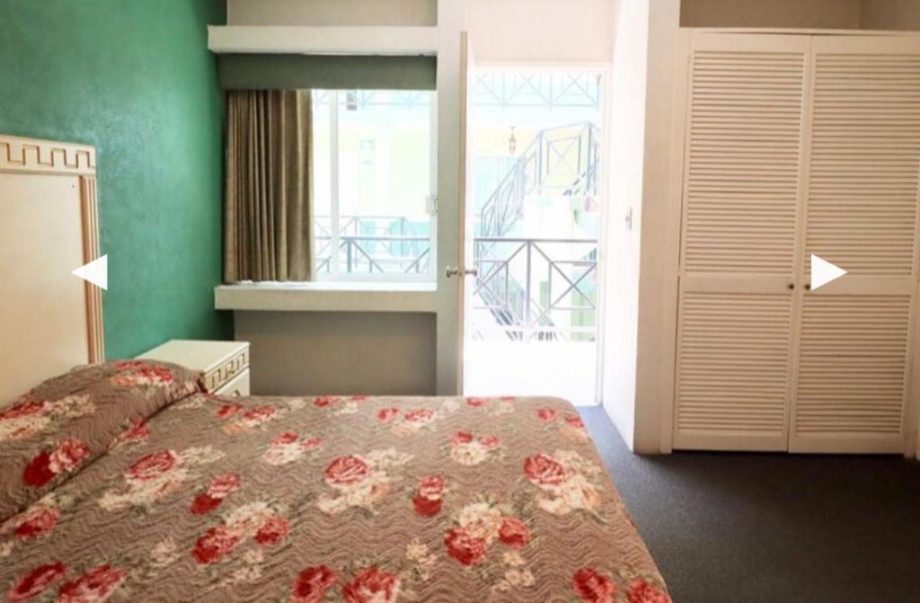 Postel nebo postele na pokoji v ubytování Hotel Real Santa Rosa