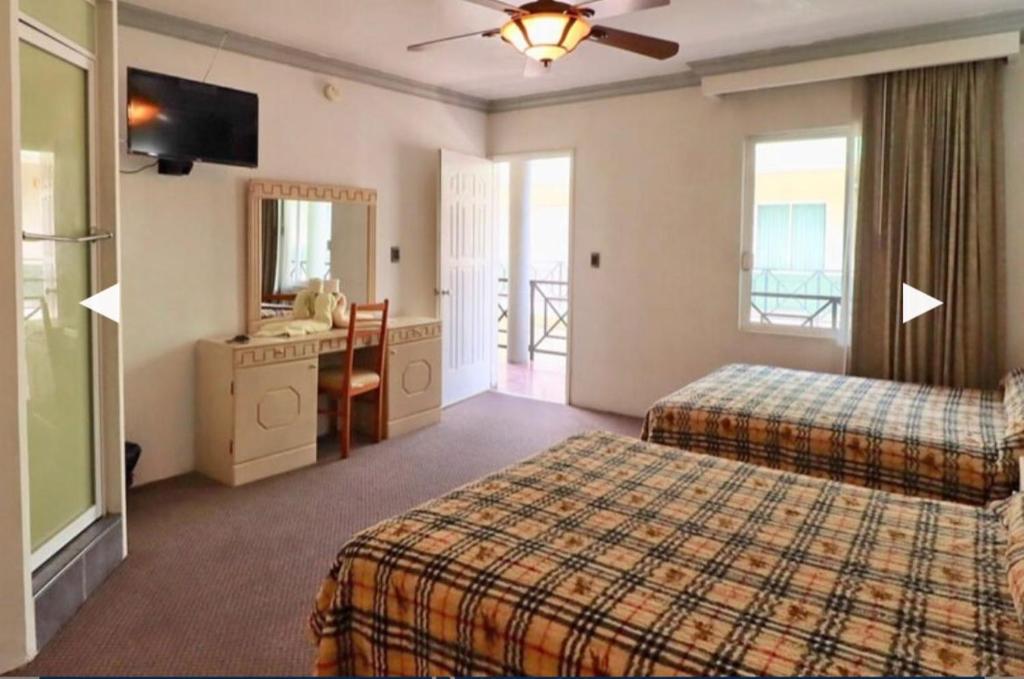 Postel nebo postele na pokoji v ubytování Hotel Real Santa Rosa