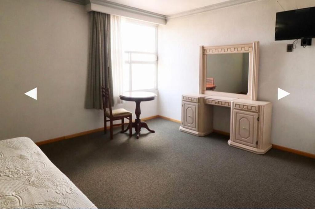 TV a/nebo společenská místnost v ubytování Hotel Real Santa Rosa
