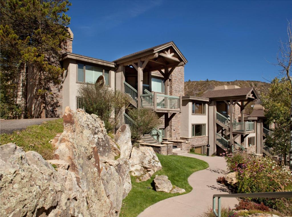 a large house with a large rock at Terracehouse - CoralTree Residence Collection in Snowmass Village