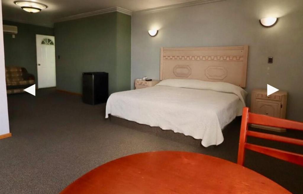 Postel nebo postele na pokoji v ubytování Hotel Real Santa Rosa