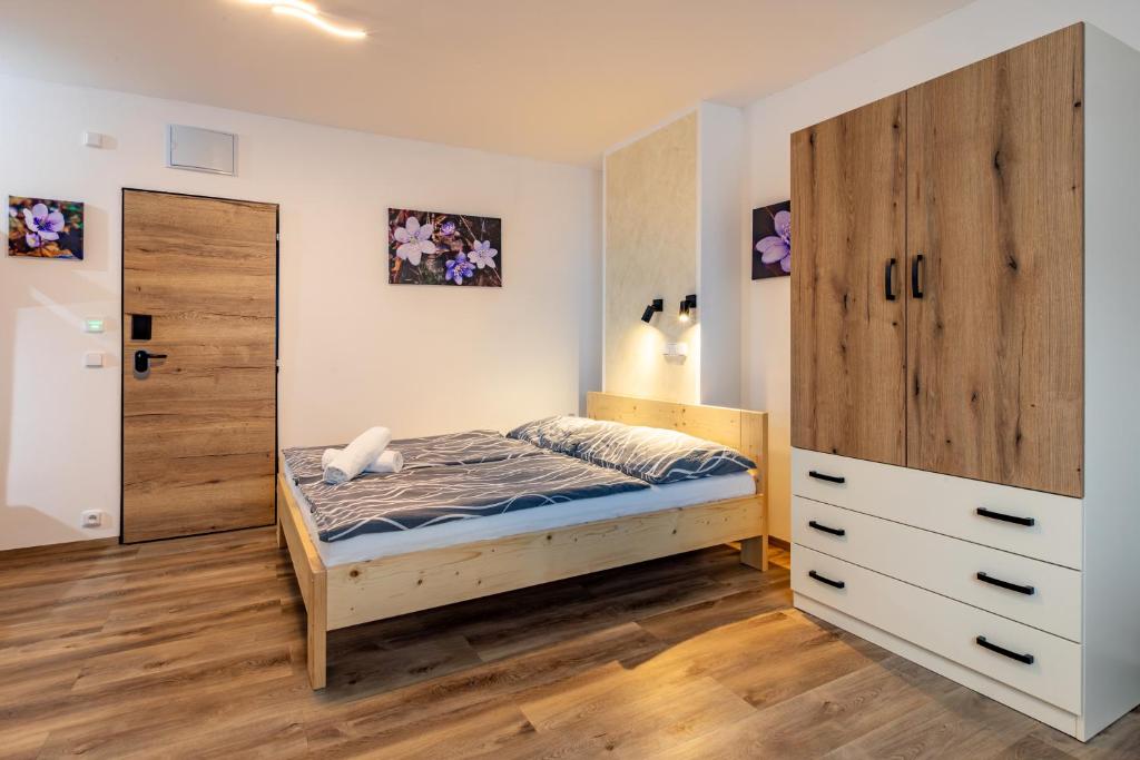 Postel nebo postele na pokoji v ubytování Penzion Kormorán