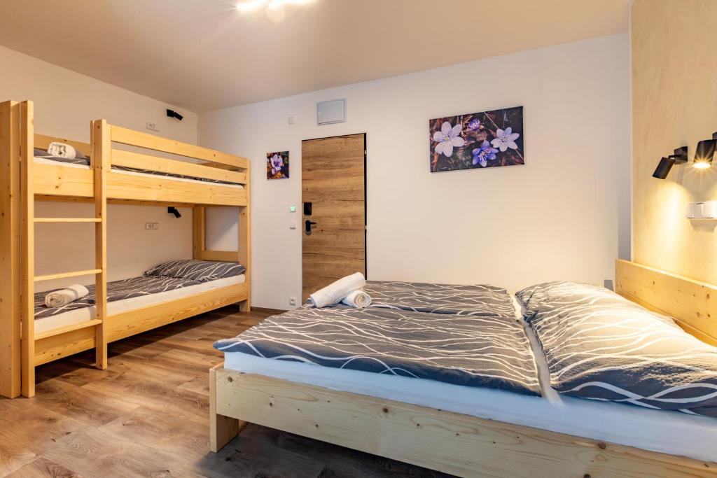 Postel nebo postele na pokoji v ubytování Penzion Kormorán