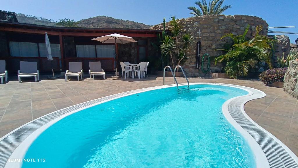 Bazén v ubytovaní ANFI TOPAZ VILLA TAURO GOLF & BEACH 3 bedrooms 4 bathrooms private pool alebo v jeho blízkosti