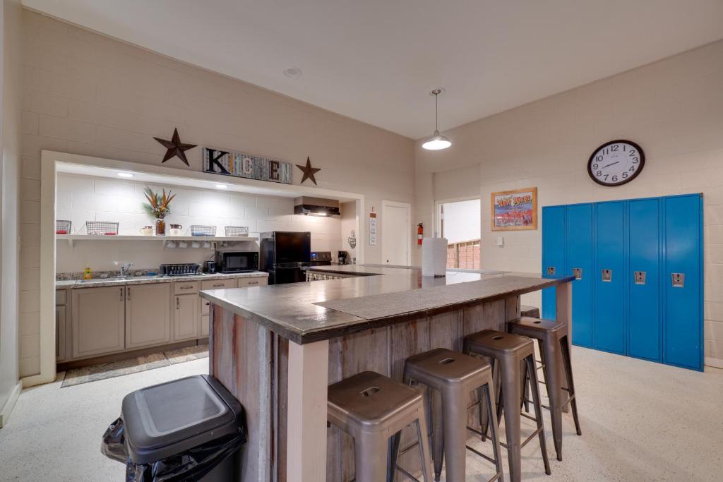a kitchen with a large counter with stools around it at Riverfront Briceville Studio Apt ATV, Hike and More 