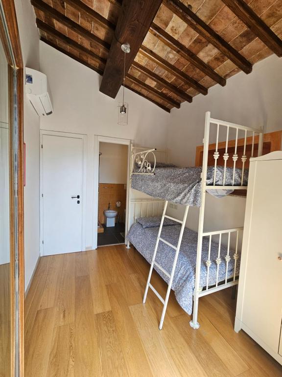 A bed or beds in a room at Villa delle lucciole