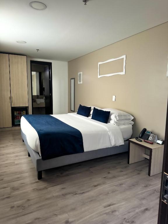 Postel nebo postele na pokoji v ubytování Hotel WLH Silver Corferias
