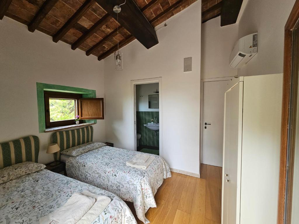 A bed or beds in a room at Villa delle lucciole