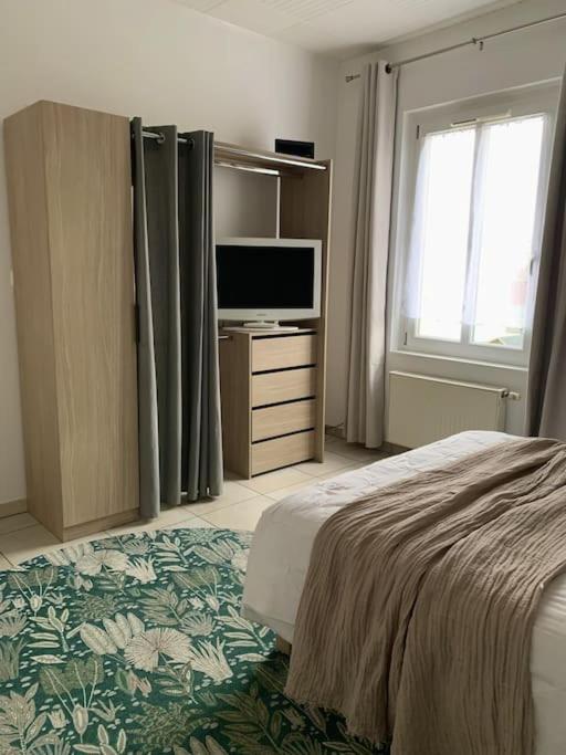 Postel nebo postele na pokoji v ubytování Charmant appartement
