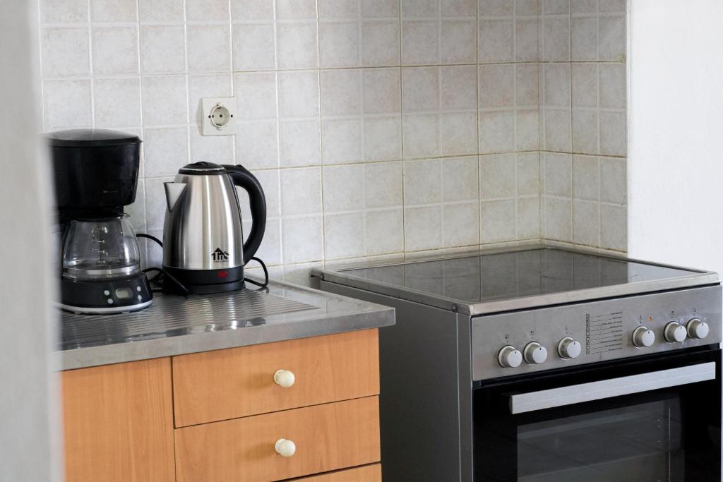 A kitchen or kitchenette at Pink Sand Sea Apartment