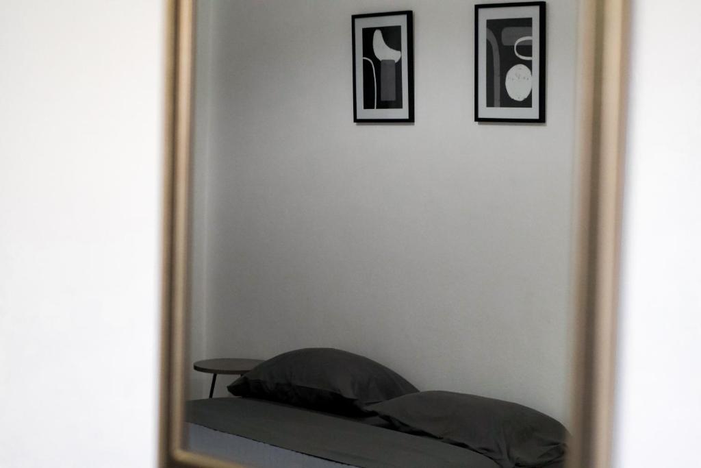 A bed or beds in a room at Pink Sand Sea Apartment