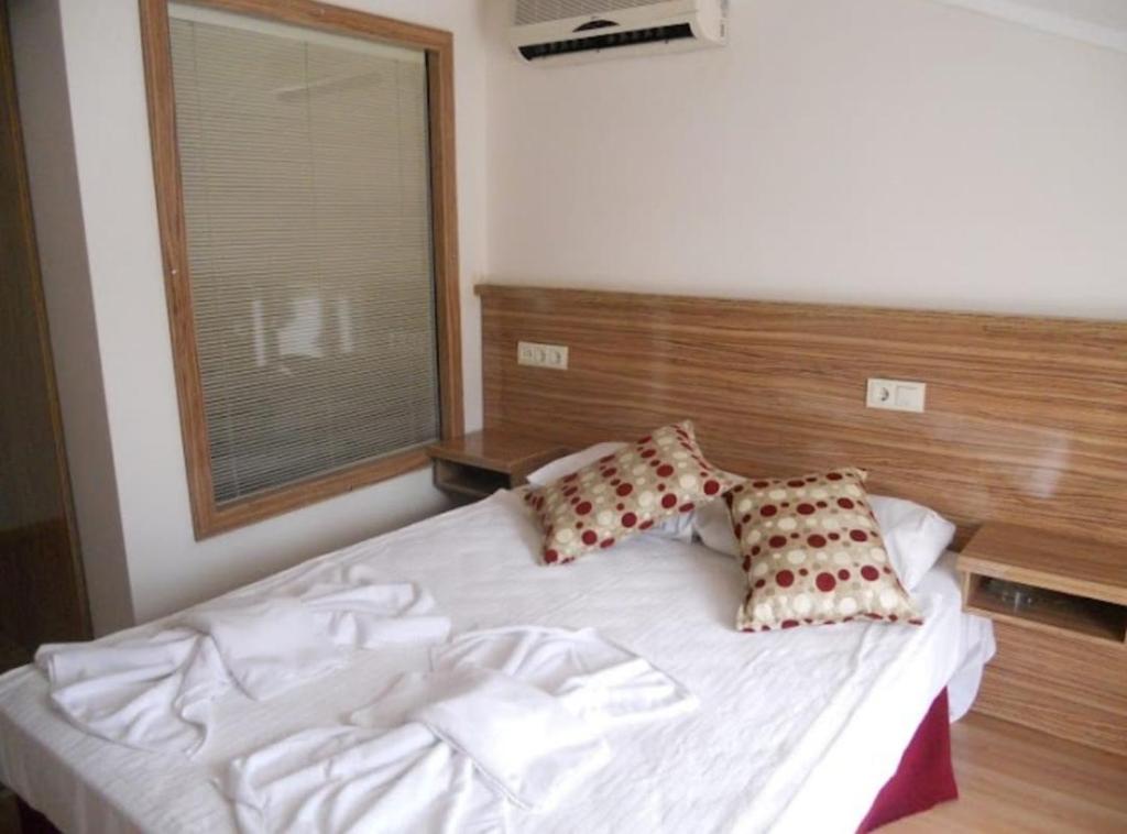 Postel nebo postele na pokoji v ubytování Hotel Barlas Fethiye