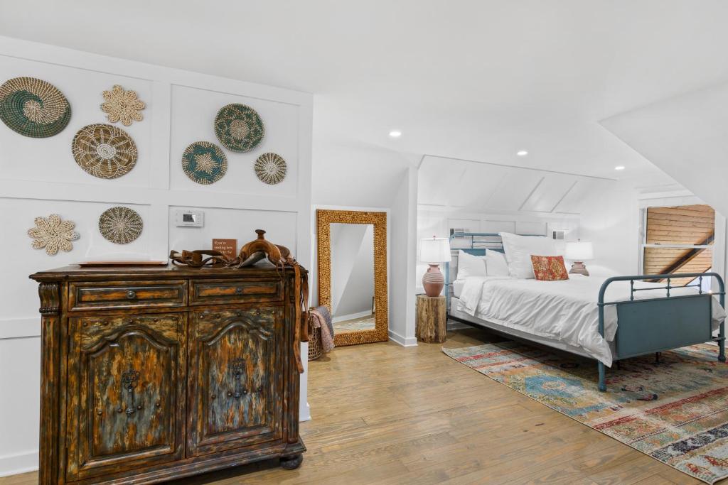 a bedroom with a bed and a dresser and a mirror at The Benton at The Rise Retreat (L2) in Hood