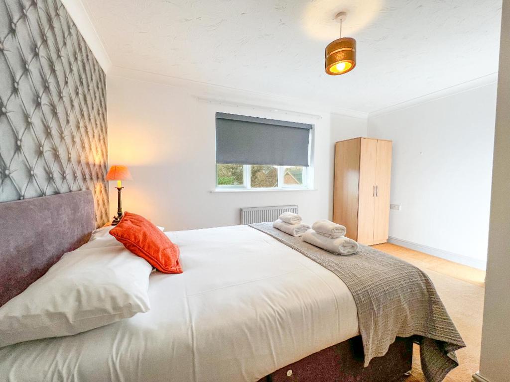 En eller flere senge i et værelse på Rider Gardens Holiday House