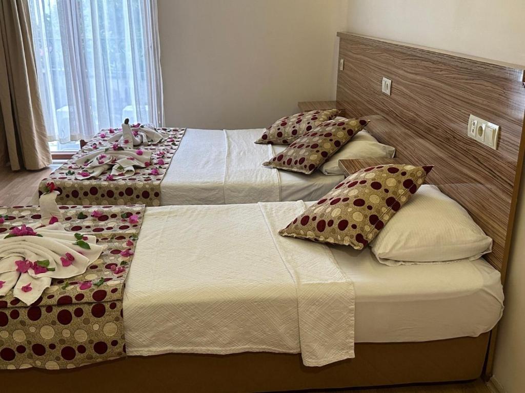 Postel nebo postele na pokoji v ubytování Hotel Barlas Fethiye