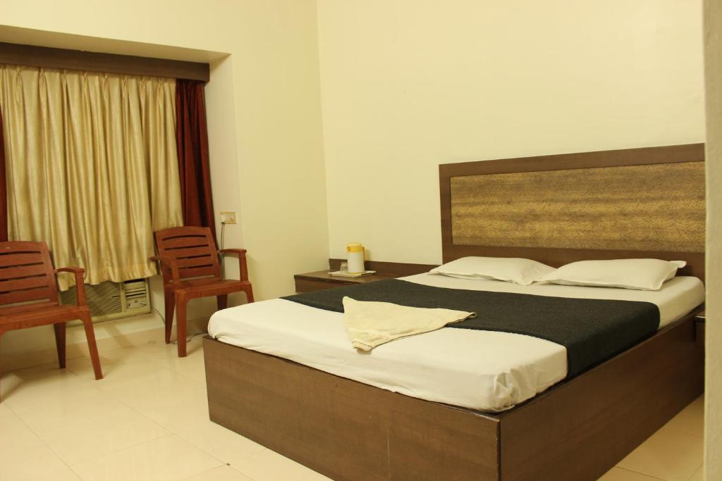 Postel nebo postele na pokoji v ubytování Hotel Laxmi Palace Newly Renovated