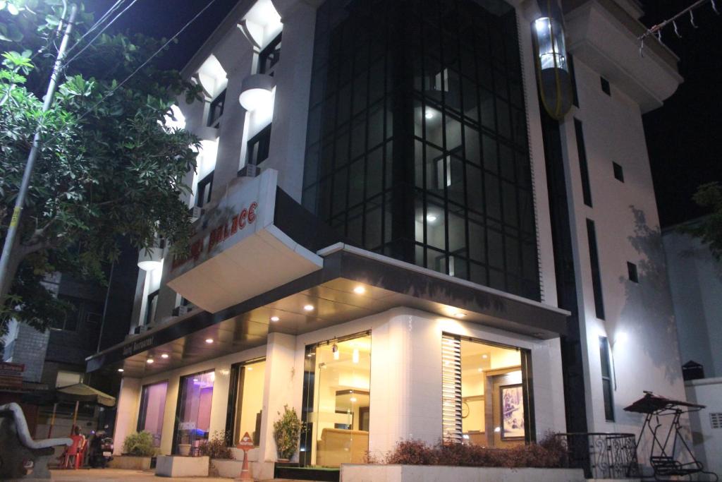 a store front of a building at night at Hotel Laxmi Palace in Shirdi