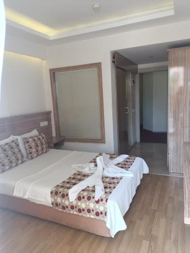 Postel nebo postele na pokoji v ubytování Hotel Barlas Fethiye