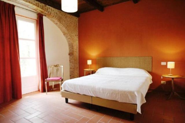 Postel nebo postele na pokoji v ubytování Agriturismo Camisassi