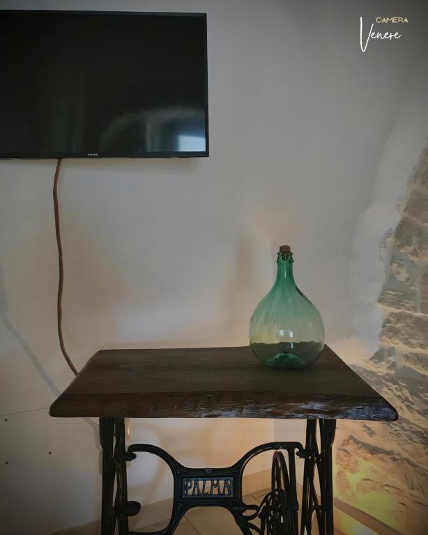 TV a/nebo společenská místnost v ubytování Trullo Galileo