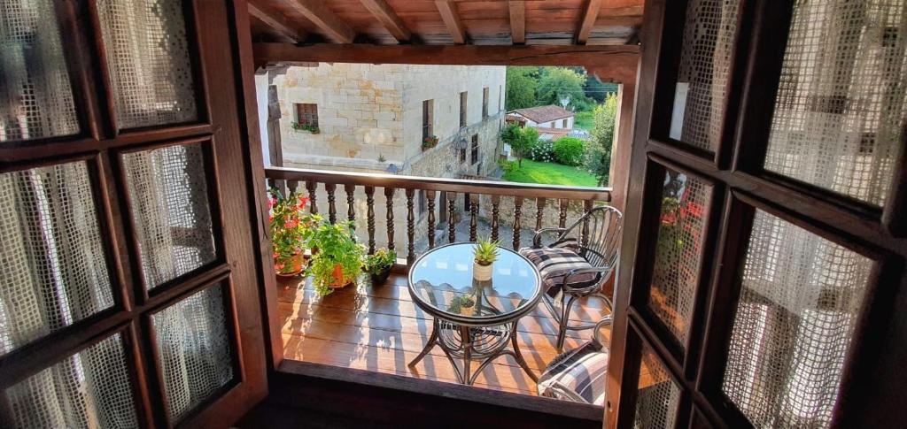 a view from a window of a balcony with a table at Casa del Lavadero in Santillana del Mar