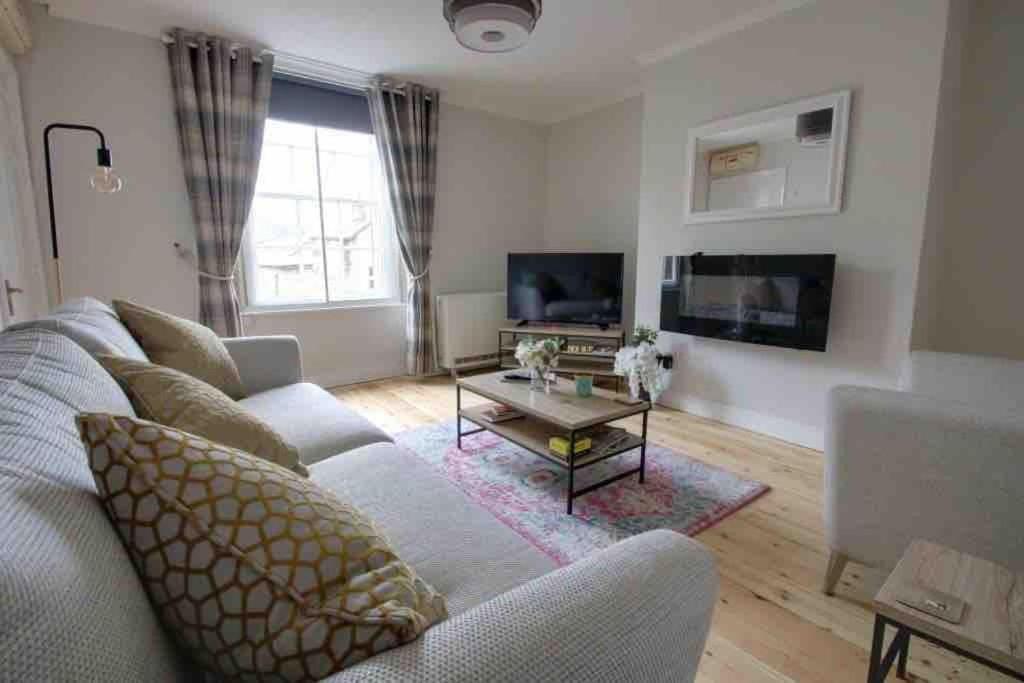 a living room with a couch and a coffee table at Bakewell- Super central 2 bed apartment in Bakewell