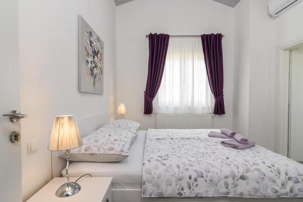 Postel nebo postele na pokoji v ubytování Rooms Anna