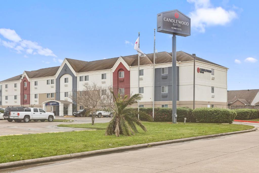 a building with a sign in front of it at Candlewood Suites Port Arthur/Nederland, an IHG Hotel in Nederland