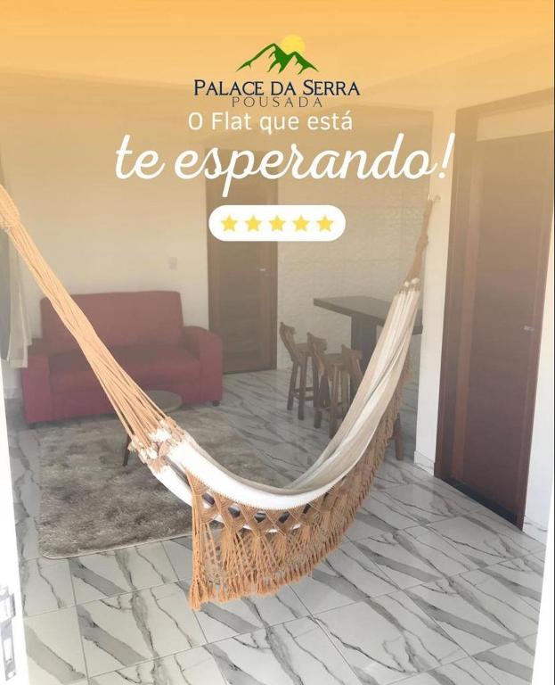 a sign that says a hammock in a living room at Flats Palace da serra in Serra de São Bento