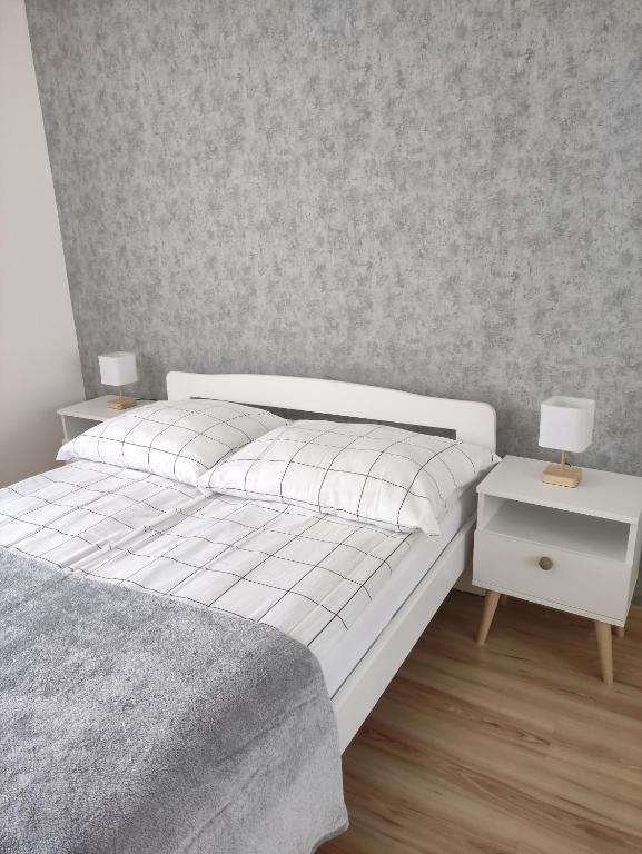 Postel nebo postele na pokoji v ubytování Villa Joanna