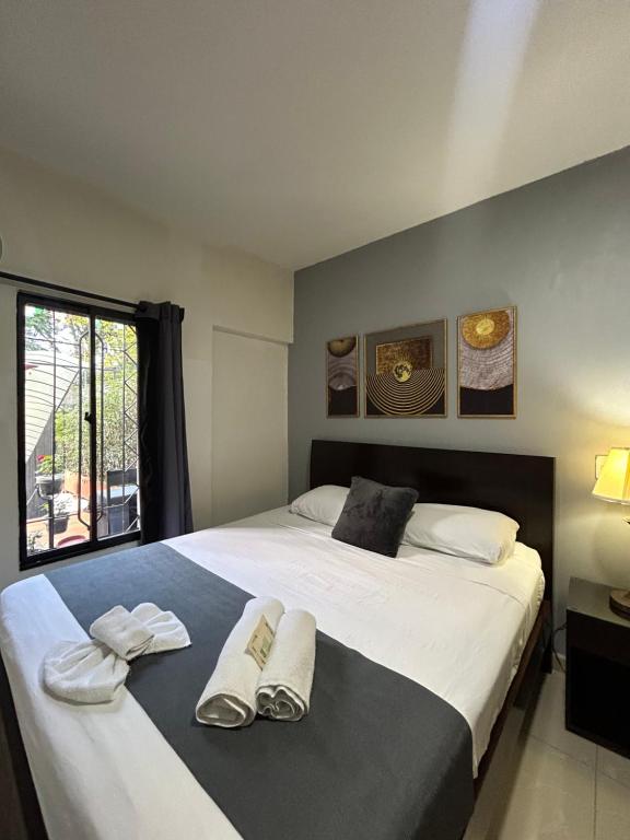 Postel nebo postele na pokoji v ubytování International Hotel Medellín