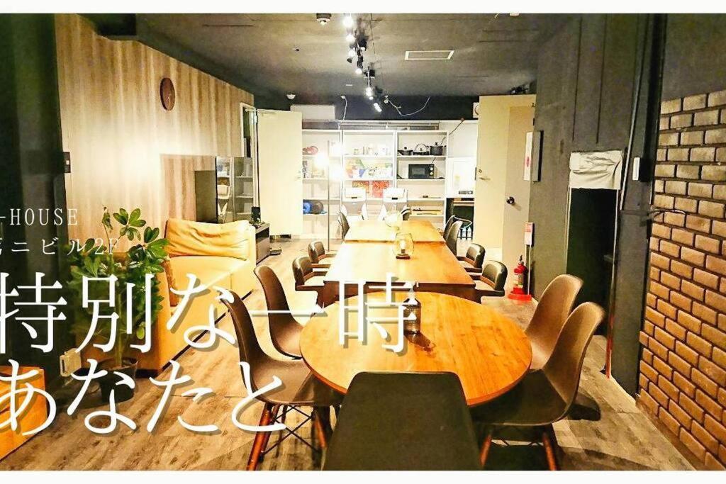 a group of tables and chairs in a room at e-house第二ビル in Tokyo