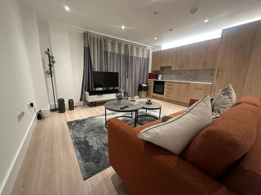 a living room with a couch and a table at Beautiful and Spacious 2 bedroom in central london in London