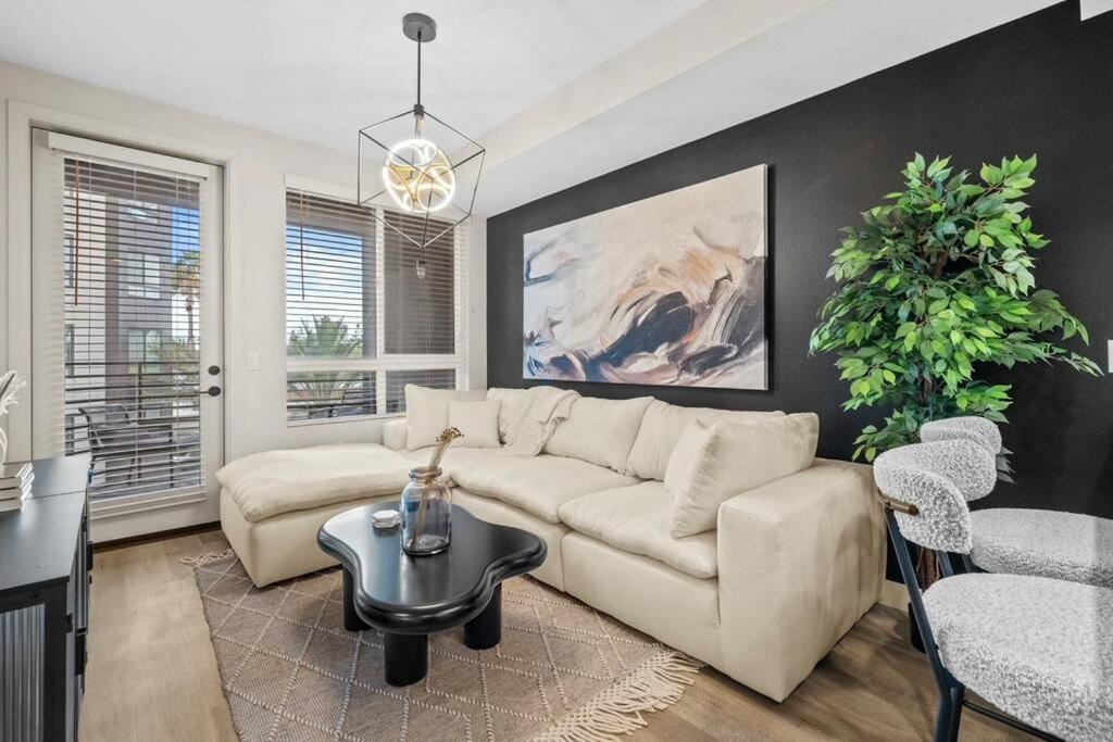 a living room with a couch and a table at Luxury Modern Condo in Irvine in Santa Ana