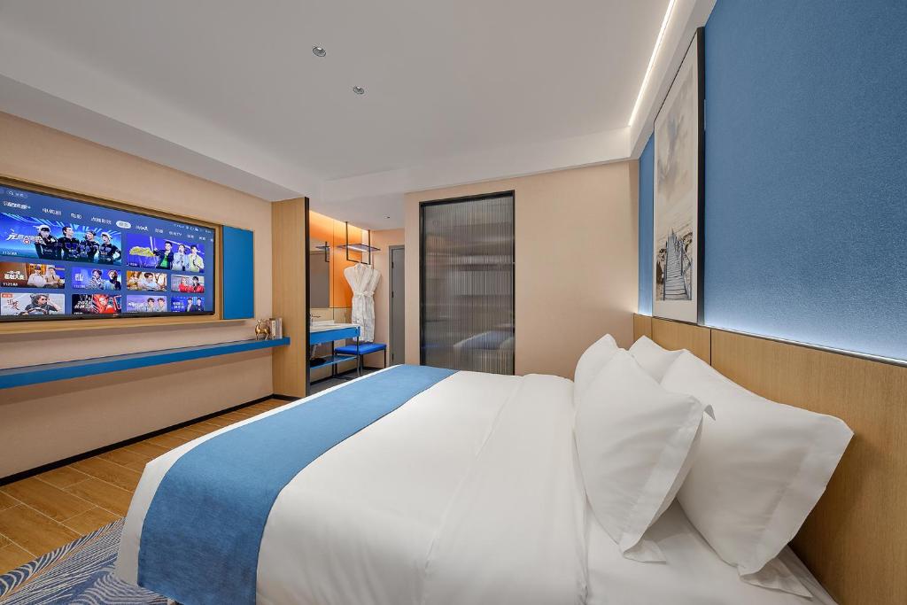Postel nebo postele na pokoji v ubytování Pearl Hotel - Gongbei Port Zhuhai