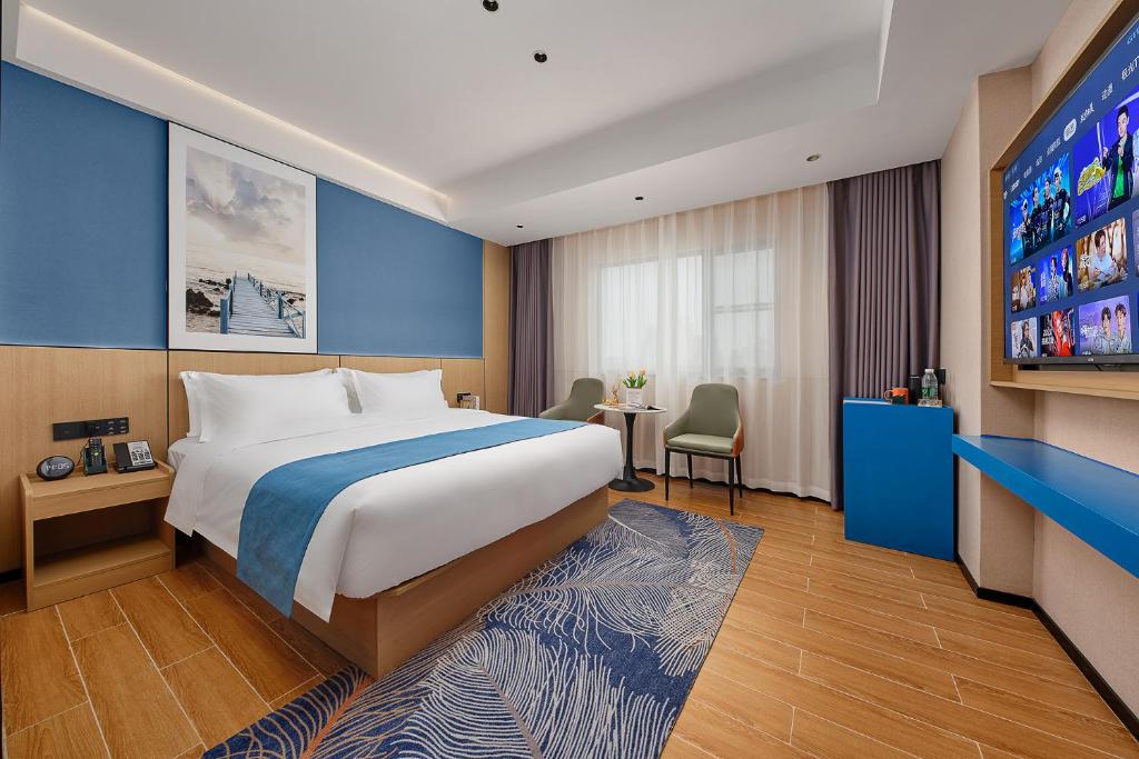 Postel nebo postele na pokoji v ubytování Pearl Hotel - Gongbei Port Zhuhai