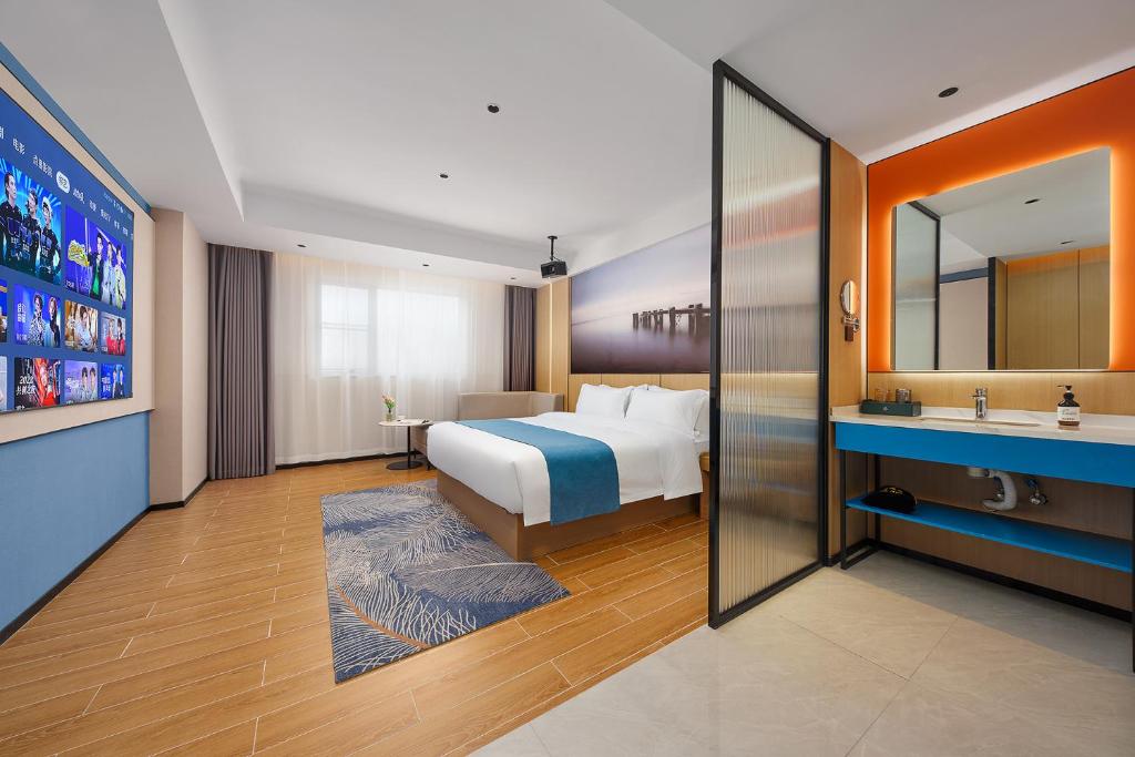Postel nebo postele na pokoji v ubytování Pearl Hotel - Gongbei Port Zhuhai