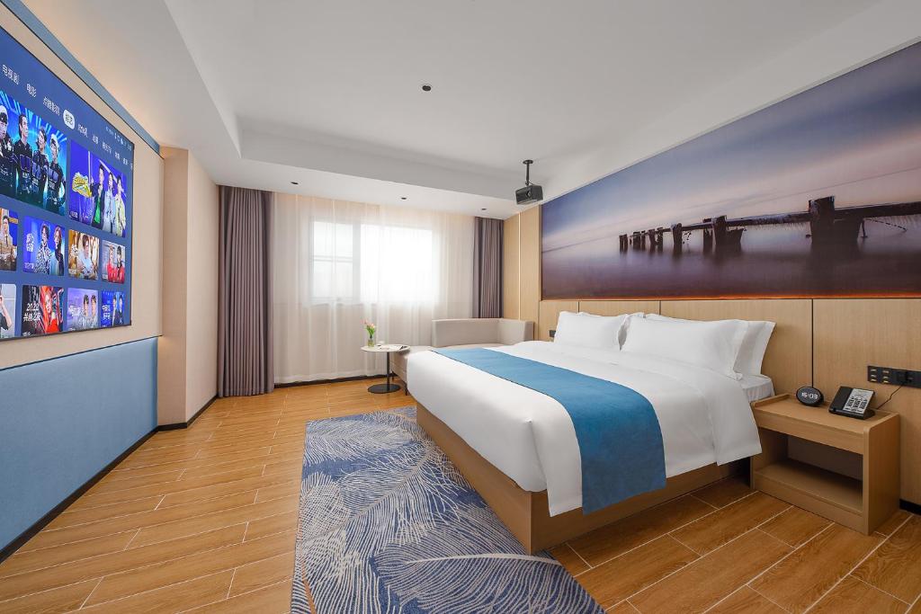 Postel nebo postele na pokoji v ubytování Pearl Hotel - Gongbei Port Zhuhai