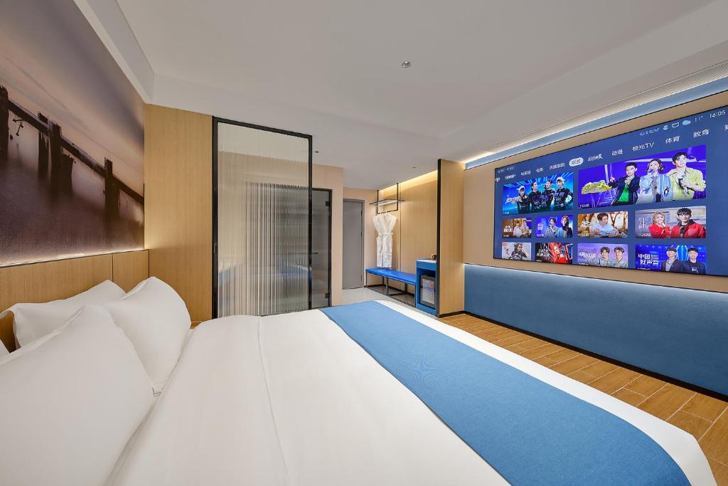 Postel nebo postele na pokoji v ubytování Pearl Hotel - Gongbei Port Zhuhai