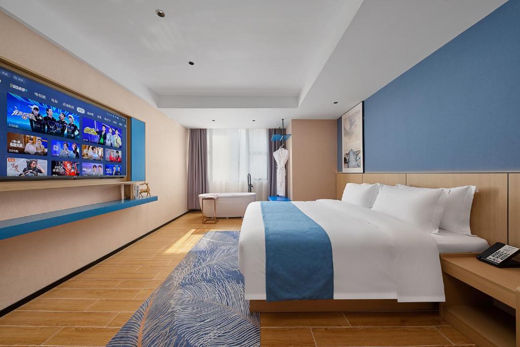 Postel nebo postele na pokoji v ubytování Pearl Hotel - Gongbei Port Zhuhai